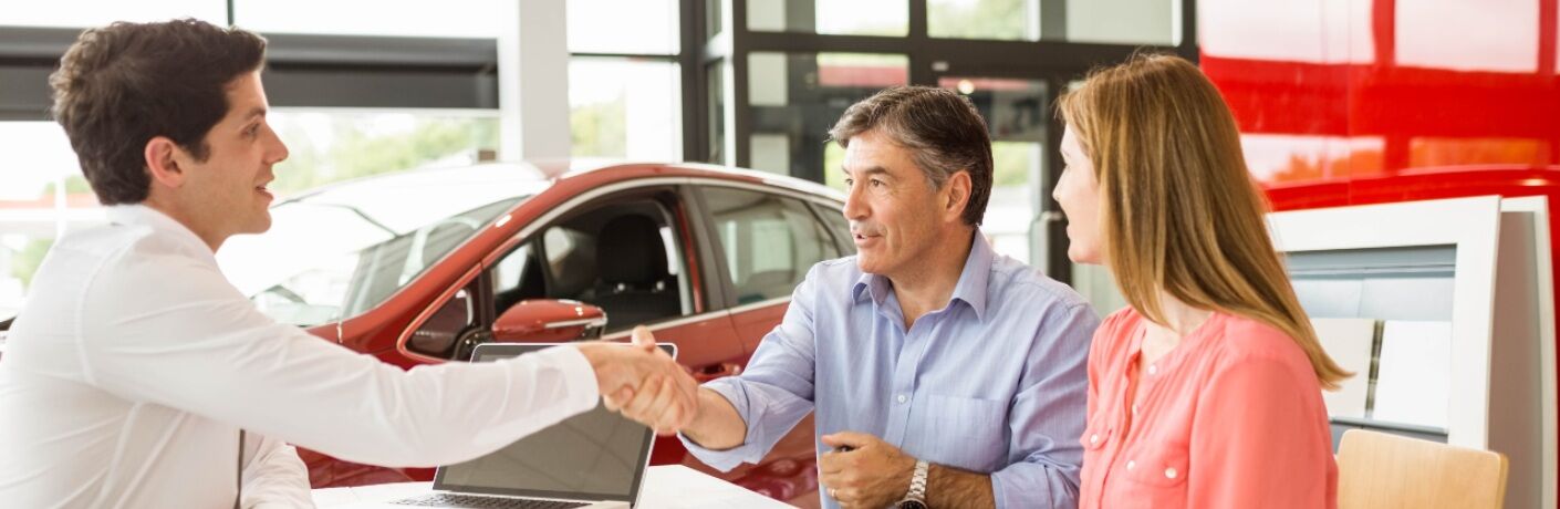 couple buying a car